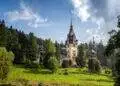 Amazing panoramic picture of the beautiful Peles Castle and its beautiful gardens near Sinaia, Romania